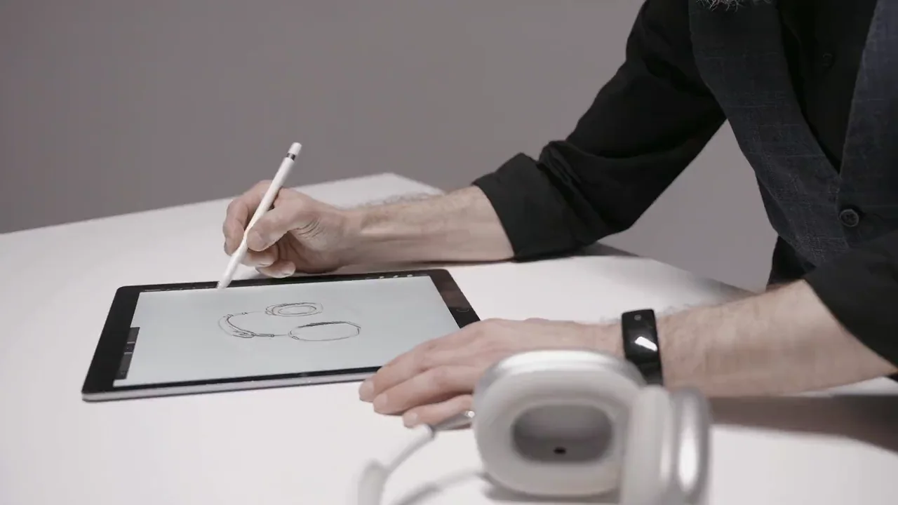 A designer developing visual concepts with a pen tablet in a creative studio